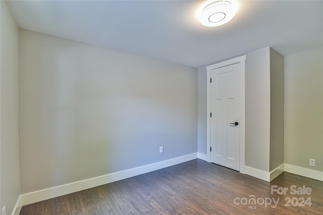 spare room featuring dark hardwood / wood-style floors