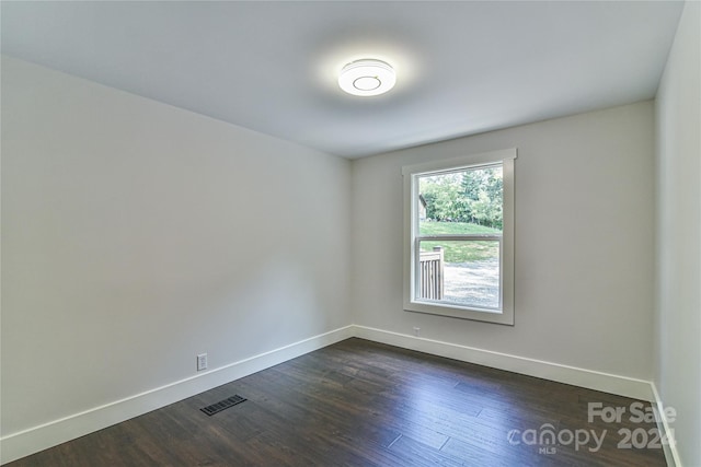 empty room featuring dark hardwood / wood-style floors