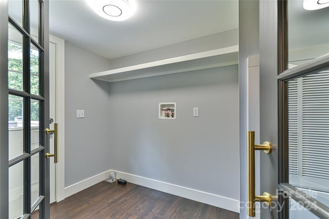 clothes washing area with washer hookup and dark hardwood / wood-style flooring