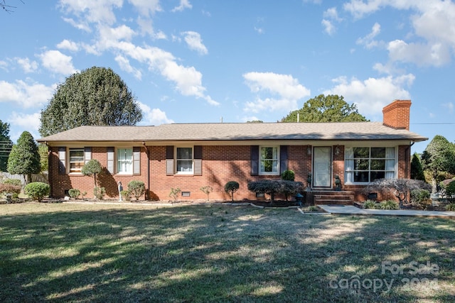 ranch-style house with a front lawn