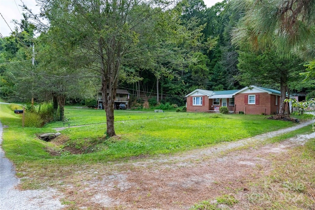 ranch-style house featuring a front lawn