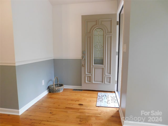 spare room with hardwood / wood-style flooring