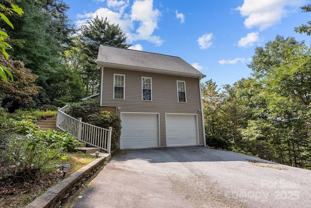 view of side of home with a garage