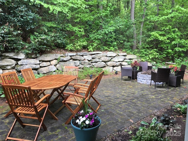 view of patio / terrace with an outdoor fire pit