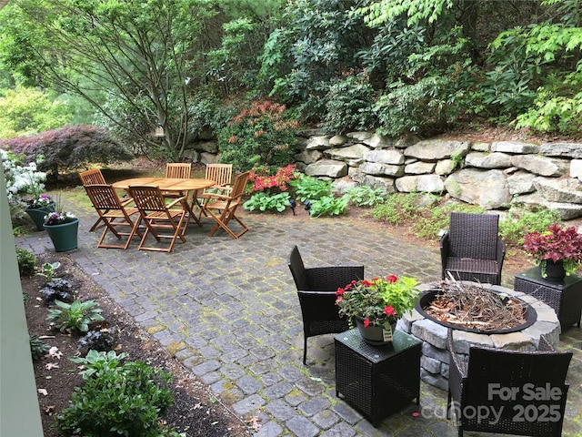 view of patio / terrace featuring a fire pit