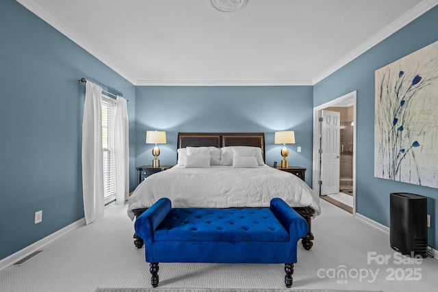 bedroom with crown molding, light carpet, and ensuite bath