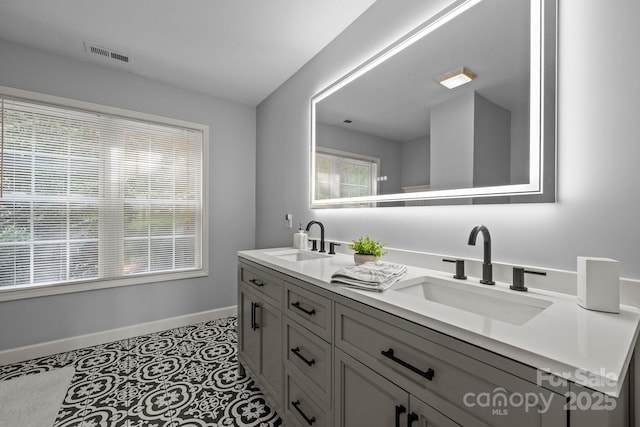 bathroom with vanity and tile patterned flooring