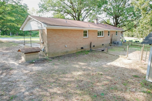 rear view of property with cooling unit