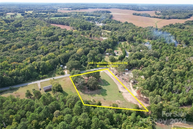 birds eye view of property featuring a rural view