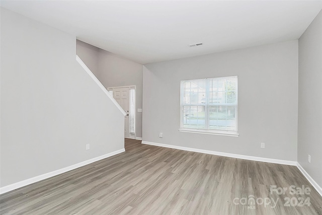 spare room featuring light hardwood / wood-style floors