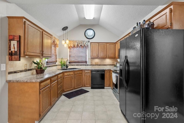 kitchen with a textured ceiling, decorative light fixtures, black appliances, sink, and lofted ceiling