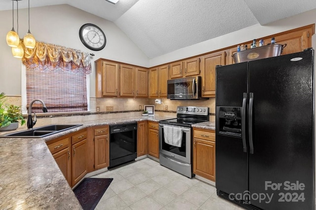 kitchen featuring pendant lighting, black appliances, vaulted ceiling, and sink