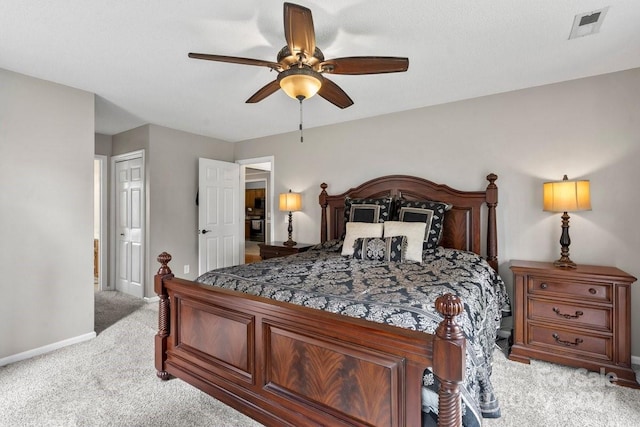 carpeted bedroom with ceiling fan and a closet