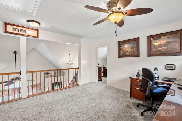 home office with ceiling fan, a textured ceiling, light carpet, and vaulted ceiling