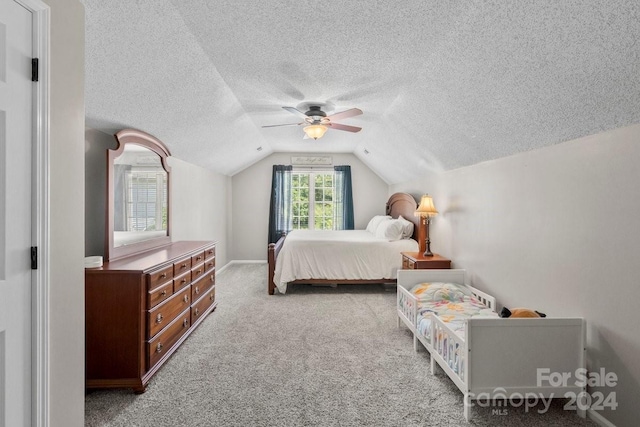 bedroom featuring light colored carpet, lofted ceiling, and ceiling fan