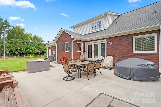 view of patio / terrace featuring central AC and french doors