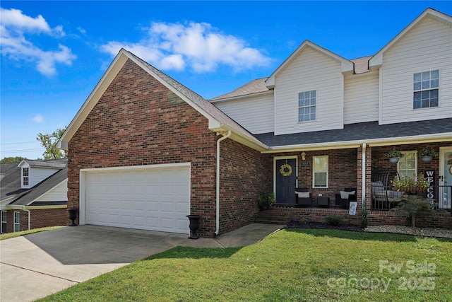 view of front of property featuring a porch, a garage, and a front lawn