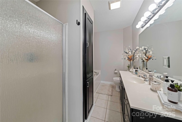 full bathroom featuring tile patterned flooring, a textured ceiling, toilet, vanity, and shower with separate bathtub