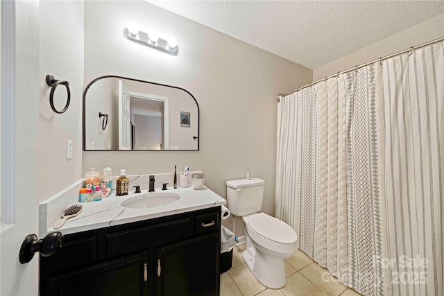 bathroom with walk in shower, tile patterned flooring, a textured ceiling, toilet, and vanity