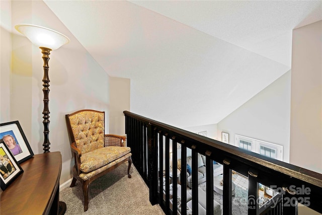 hall featuring carpet, french doors, and vaulted ceiling