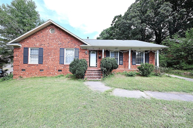 view of front facade with a front yard and a porch