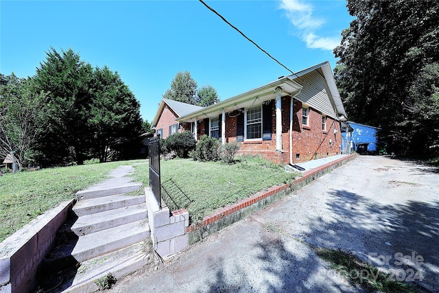 view of property exterior featuring a lawn