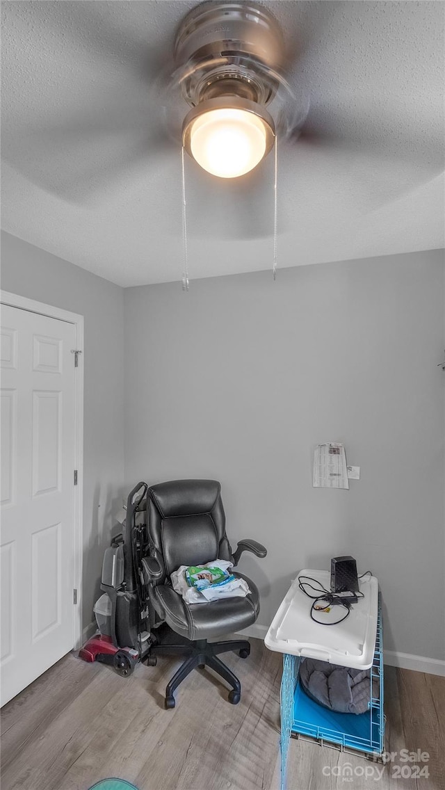 office featuring hardwood / wood-style floors and a textured ceiling