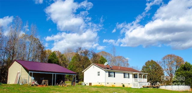 back of house featuring a yard