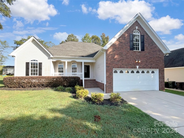 front of property featuring a garage, a front yard, and a porch