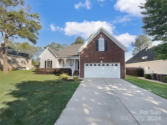 view of property featuring a porch, a garage, and a front yard