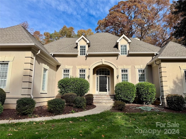 view of property with a front lawn