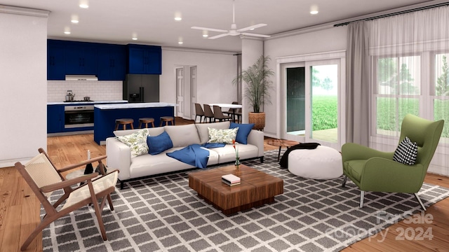 living room with ornamental molding, hardwood / wood-style flooring, and ceiling fan