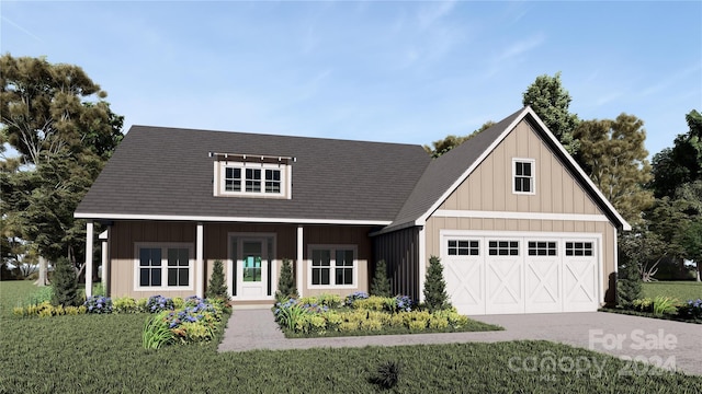 view of front of home featuring a garage and a front yard