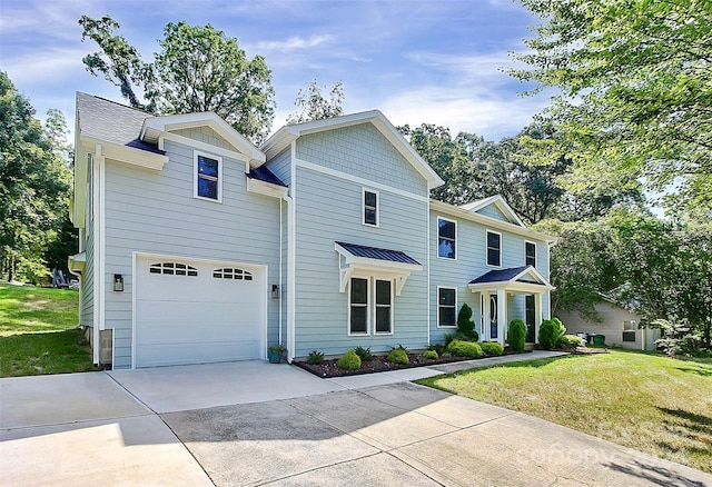 view of front of home with a garage and a front yard