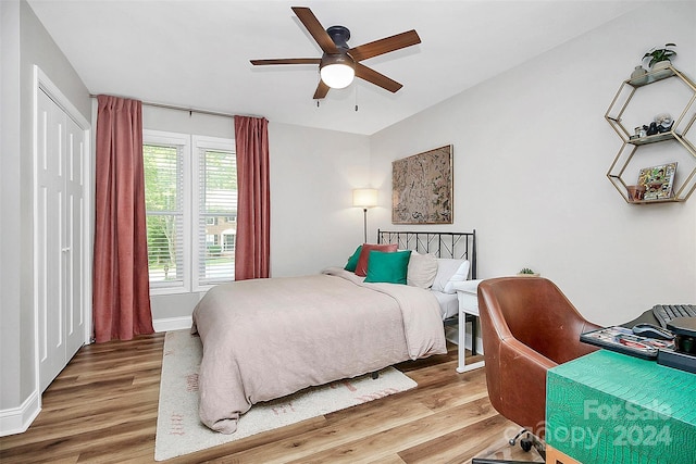 bedroom featuring ceiling fan and hardwood / wood-style floors