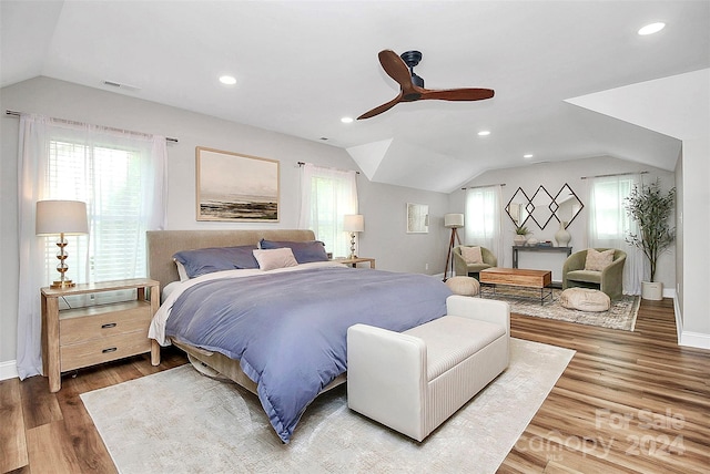 bedroom featuring ceiling fan, wood-type flooring, and vaulted ceiling