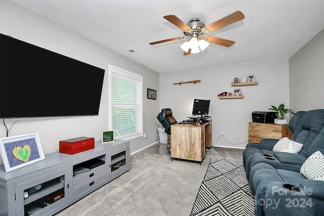 living room with ceiling fan and carpet floors