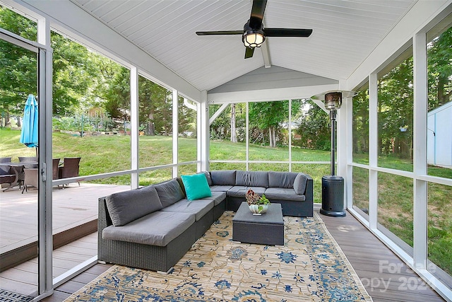 sunroom / solarium with lofted ceiling and ceiling fan