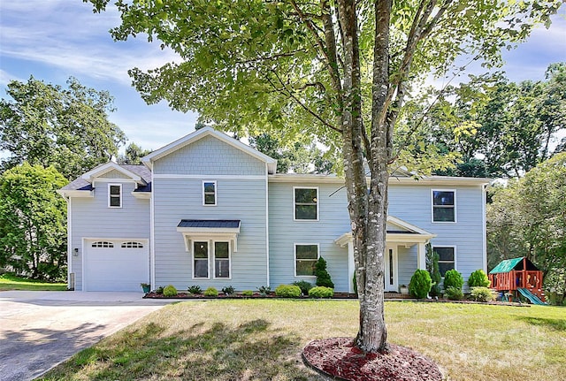 front facade featuring a garage, a front lawn, and a playground