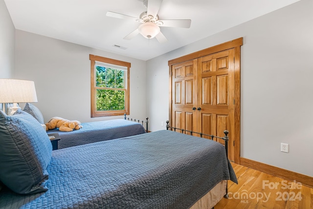 bedroom featuring ceiling fan and hardwood / wood-style floors