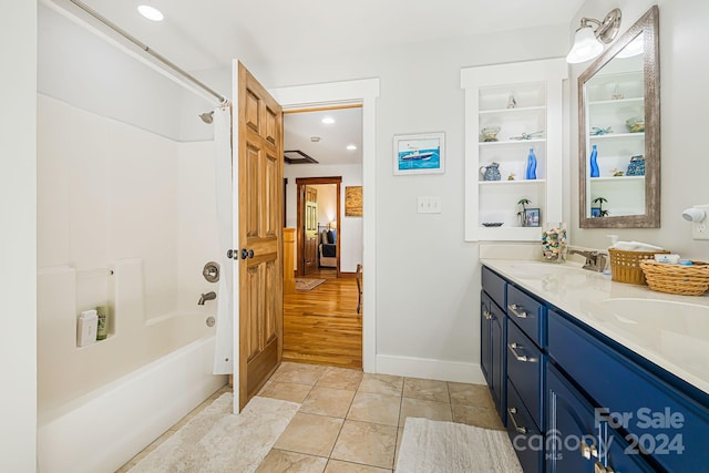 bathroom with vanity, bathtub / shower combination, and hardwood / wood-style floors