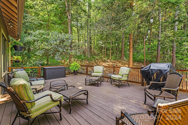 deck featuring an outdoor hangout area and a grill