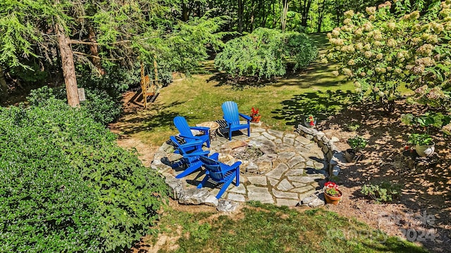 view of yard with a fire pit