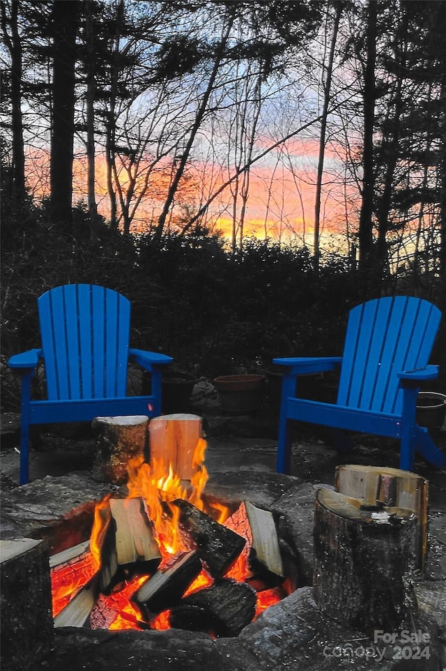 patio terrace at dusk with an outdoor fire pit