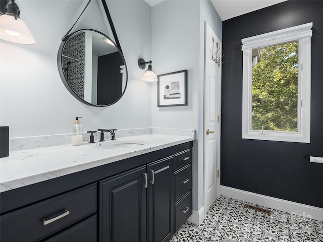 bathroom featuring tile patterned flooring and vanity