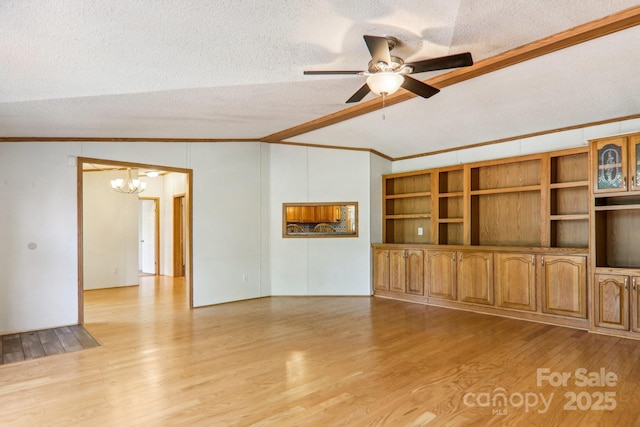 18 Spencer Rd, Candler, NC 28715 - unfurnished living room with ornamental molding, a textured ceiling, a chandelier, light wood finished floors, and a ceiling fan