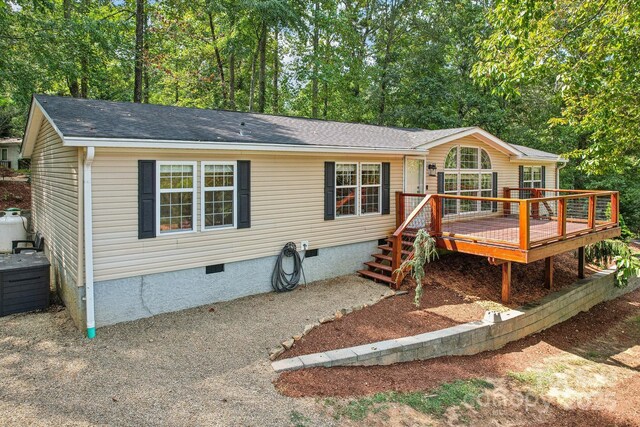 18 Spencer Rd, Candler, NC 28715 - manufactured / mobile home featuring crawl space, a wooden deck, and roof with shingles