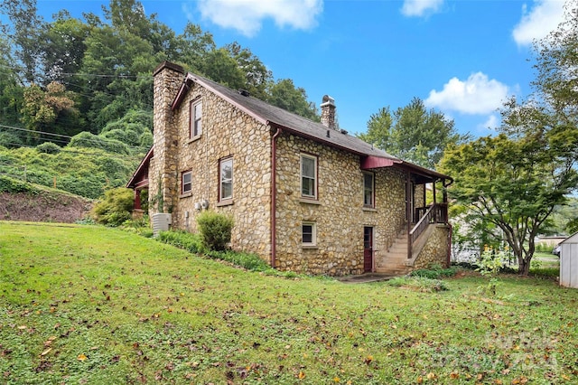 view of home's exterior with a yard