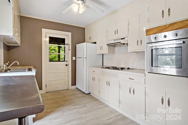 kitchen featuring white cabinets, white appliances, ceiling fan, and sink