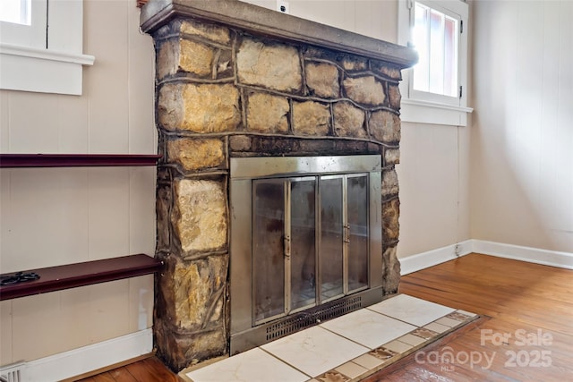 room details featuring hardwood / wood-style flooring and a fireplace